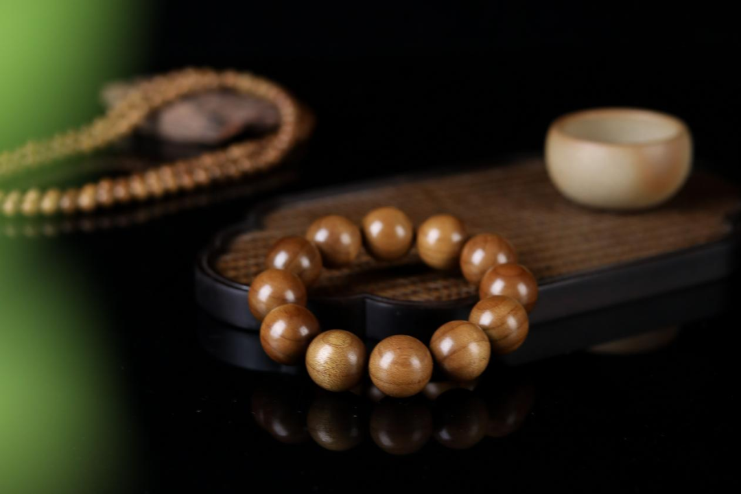 金丝楠木摆件寓意_金丝楠老料横切面图片_金丝楠木手串价格