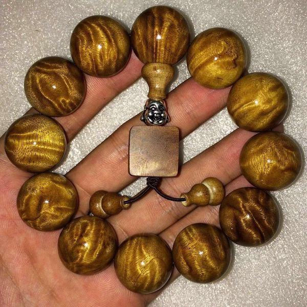 金丝楠木特性与价值_金丝楠手串龙胆纹鉴别_金丝楠老料横切面图片