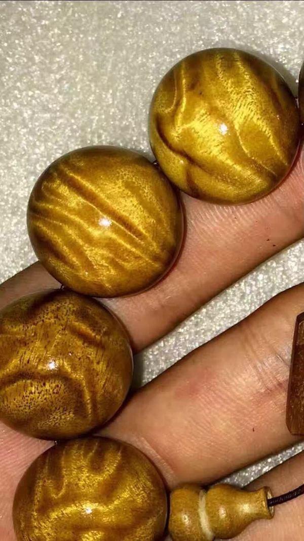 金丝楠手串龙胆纹鉴别_金丝楠木特性与价值_金丝楠老料横切面图片